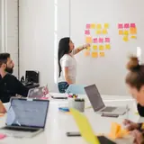A company team meeting around a table